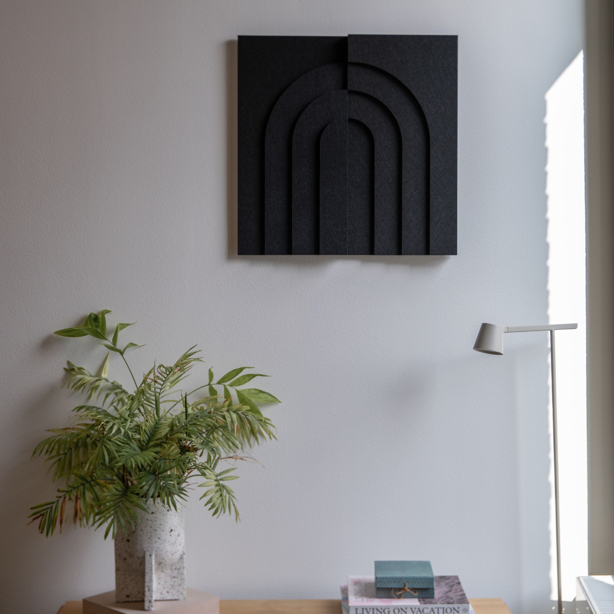 Black Arch tile acoustic panel by Arturel for sound absorption in living room